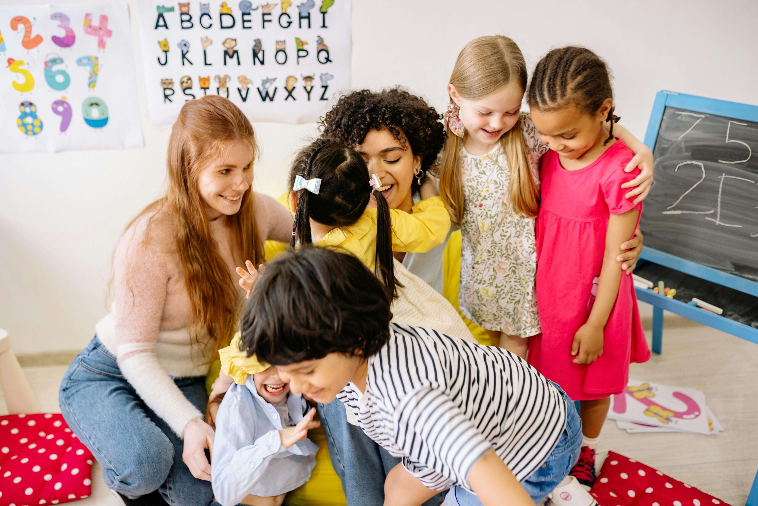 Parents and children in nursery classroom.