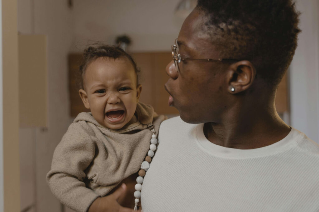 Parent comforting upset child.