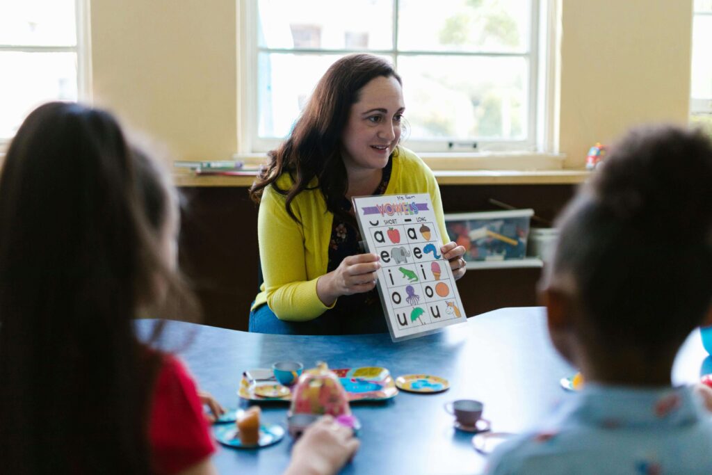Child listening to an adult read a picture book.